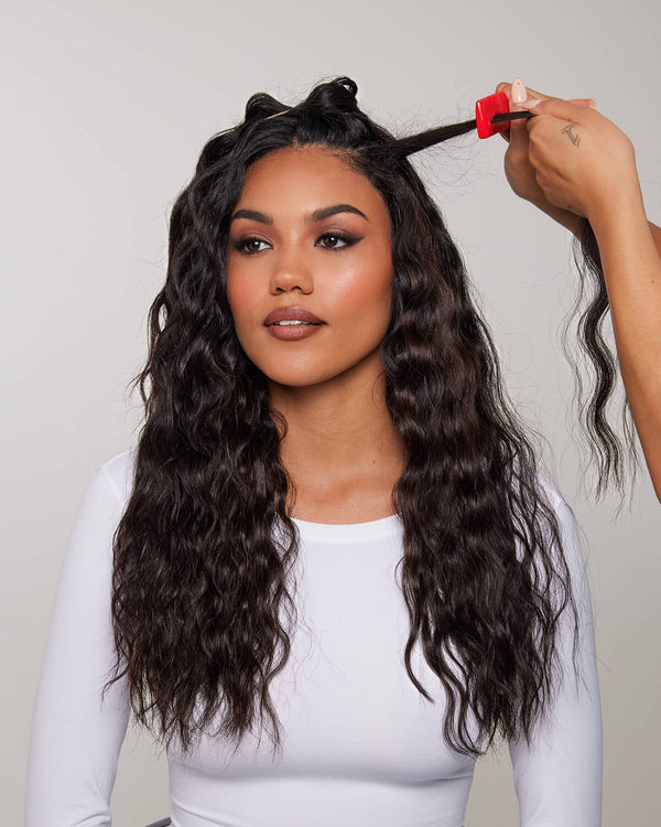 Gently back comb the roots with a comb or brush. This helps the clips stay secure.